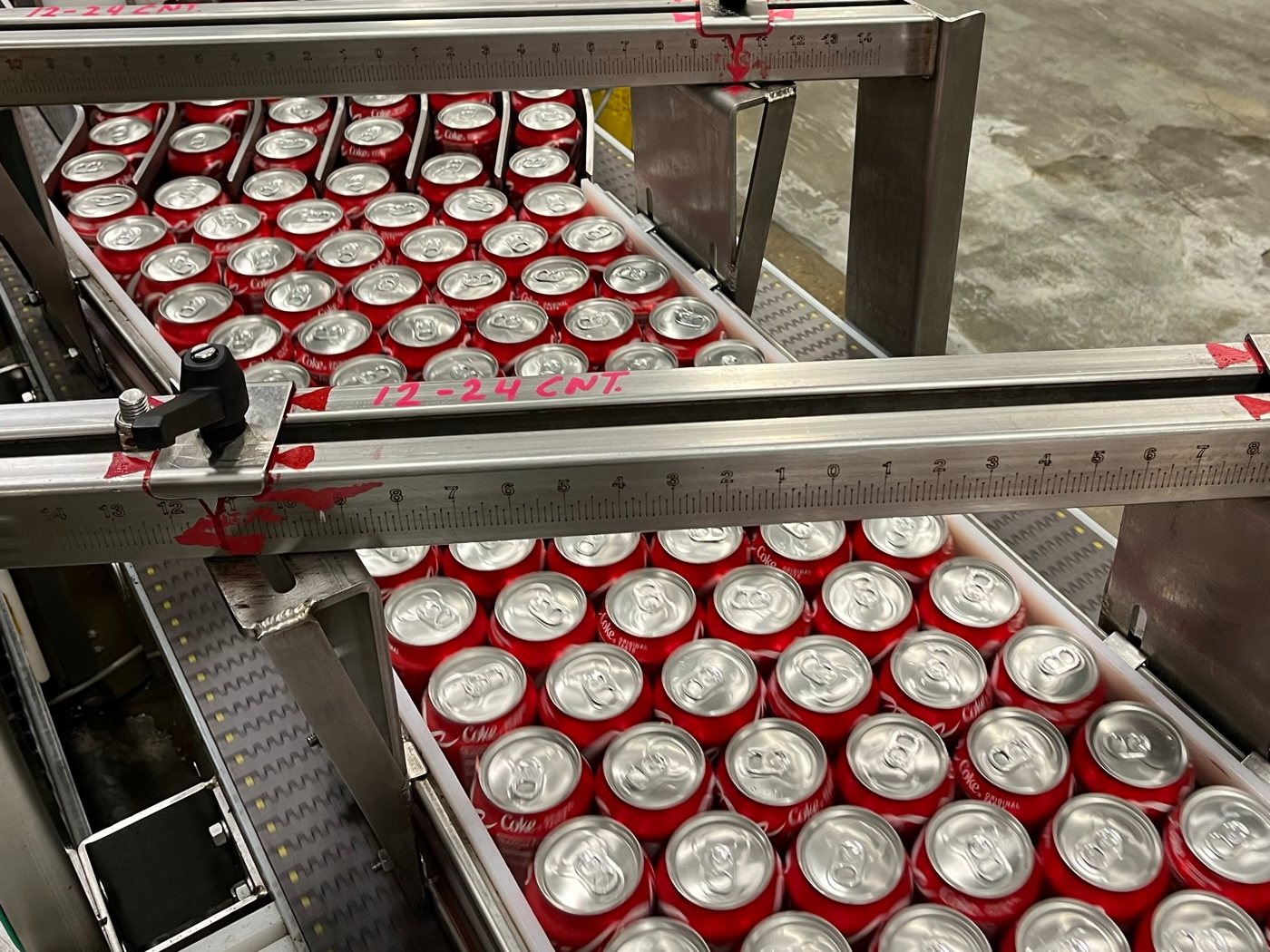 Guide rails with steel rules and painted match-marks on a can line